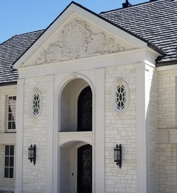 Front Entry of house made of white cast stone and cast stone bricks