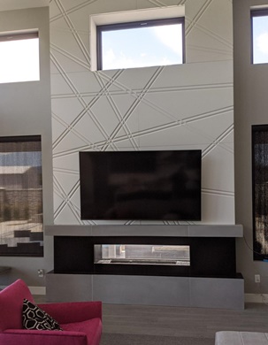 modern white fireplace with design lines made with cast stone